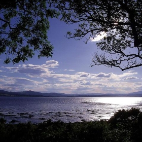 Redcastle Bay looking towards the mountains of Western Inverness-shire and Ross-shire Black Isle Scotland - conner395